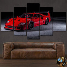 Load image into Gallery viewer, F40 Canvas multi-panel wall art featuring a red Ferrari sports car above a brown leather sofa.