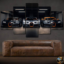 Load image into Gallery viewer, Modern Bugatti Canvas wall art featuring five framed panels with luxury sports cars displayed above a brown leather sofa