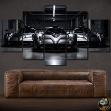 Load image into Gallery viewer, Pagani supercar multi-panel canvas wall art above brown leather sofa