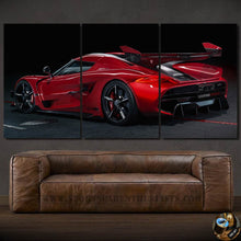 Load image into Gallery viewer, Three-piece canvas wall art featuring a red Koenigsegg Jesko sports car displayed above a brown leather sofa