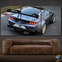Load image into Gallery viewer, Three-panel canvas wall art featuring the rear view of a gray Ford Mustang GTD with a large spoiler, displayed above a brown leather sofa.