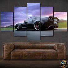 Load image into Gallery viewer, Five-piece framed Chevrolet Corvette wallpaper canvas above brown leather sofa with purple sky background