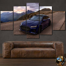 Load image into Gallery viewer, Audi RS6-S canvas wall art featuring a blue sports car on a mountain road above a brown leather sofa