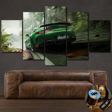 Load image into Gallery viewer, Five-piece framed GT R sports car canvas wall art above brown leather sofa