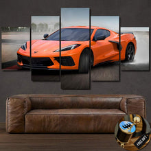 Load image into Gallery viewer, Chevrolet Corvette C8 Z06 orange sports car canvas wall art set above brown leather sofa with free gear shifter keychain gift