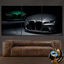 Load image into Gallery viewer, Triptych canvas wall art featuring BMW M3 G80 cars in silver and green with illuminated headlights above a brown leather sofa