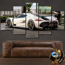 Load image into Gallery viewer, Koenigsegg Jesko sports car printed on multi-panel canvas wall art above a brown leather sofa