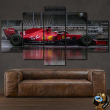 Load image into Gallery viewer, Formula F1 canvas featuring a multi-panel framed red Formula 1 racing car wall art above a brown leather sofa