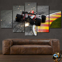 Load image into Gallery viewer, Formula F1 Canvas wall art featuring a racing car on track with sparks, displayed above a brown leather sofa