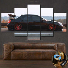 Load image into Gallery viewer, Impreza WRX STI black sports car multi-panel canvas wall art above brown leather sofa with gear shifter keychain gift