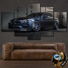 Load image into Gallery viewer, BMW M5 canvas wall art with five-panel framed car photo above brown leather sofa, free gear shifter keychain gift