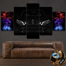 Load image into Gallery viewer, BMW E60 M5 Canvas wall art with black car front and colorful smoke accents, perfect for sports car enthusiasts.