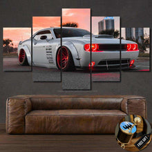 Load image into Gallery viewer, Dodge Challenger SRT multi-panel canvas wall art with red headlights displayed above a brown leather sofa