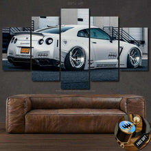 Load image into Gallery viewer, Nissan GT-R R35 Liberty Walk white sports car multi-panel canvas wall art above brown leather sofa with free gear shifter keychain gift