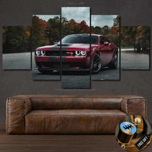 Load image into Gallery viewer, Dodge Challenger SRT canvas wall art with red muscle car and forest background, five-piece framed automotive decor above brown leather sofa