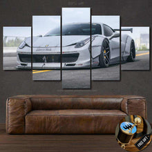 Load image into Gallery viewer, Multi-panel canvas wall art featuring 458 Italia Liberty Walk sports car above a brown leather sofa with free gear shifter keychain gift.