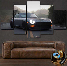 Load image into Gallery viewer, Datsun 280Z sports car multi-panel canvas wall art displayed above a brown leather couch