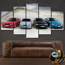 Load image into Gallery viewer, Multi-panel framed canvas wallpaper featuring four BMW M3 E36 cars in different colors displayed above a brown leather sofa