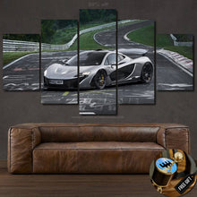 Load image into Gallery viewer, Multi-panel McLaren sports car wallpaper canvas set above brown leather sofa on dark wall