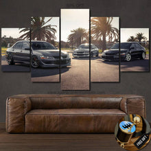 Load image into Gallery viewer, Mitsubishi Evolution EVO canvas wall art with five-panel design featuring sports cars and palm trees in sunset light, perfect for car enthusiasts.