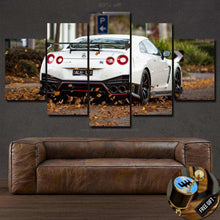 Laden Sie das Bild in den Galerie-Viewer, Multi-panel Nissan GT-R R35 Canvas wall art above brown leather sofa in modern living room