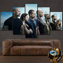 Load image into Gallery viewer, Fast & Furious Canvas multi-panel wall art featuring main cast above brown leather sofa with free gear shifter keychain gift