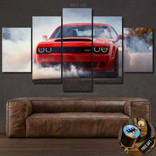 Load image into Gallery viewer, Multi-panel Dodge Challenger SRT wallpaper canvas print above brown leather sofa, featuring red car with smoke effect.