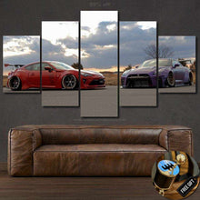Load image into Gallery viewer, GT86 and GT-R R35 sports cars photo canvas wall art set above brown leather sofa