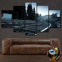 Load image into Gallery viewer, Nurburgring Nordschleife racing track multi-panel canvas wall art above brown leather sofa