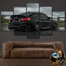 Load image into Gallery viewer, BMW M4 Canvas wall art multi-panel framed print above brown leather sofa with free gear shifter keychain gift