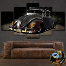 Load image into Gallery viewer, Multi-panel VW Beetle wallpaper canvas print above brown leather sofa, vintage car art for sports car enthusiasts.