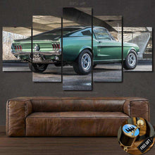 Load image into Gallery viewer, Ford Mustang Bullitt vintage car printed canvas wall art in multiple panels above brown leather sofa