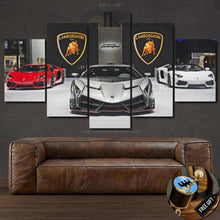 Load image into Gallery viewer, Multi-panel Lamborghini wallpaper canvas featuring red, white, and silver Lamborghini cars displayed above a brown leather sofa