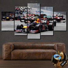 Load image into Gallery viewer, Monaco F1 Canvas multi-panel wall art featuring race cars on track above brown leather sofa