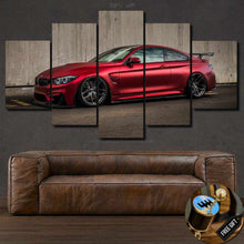 Load image into Gallery viewer, Red BMW M4 car wall art canvas set above brown leather sofa, framed multi-panel automotive photo print