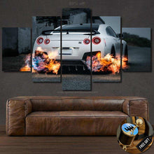 Load image into Gallery viewer, Nissan GT-R R35 canvas wall art with rear view and flames, five-piece framed car photo print above leather sofa, free gear shifter keychain gift
