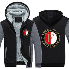 Load image into Gallery viewer, Black and gray FC Feyenoord hoodie with zipper and fleece lining, featuring logo on chest and back, unisex adult EU/US sizes.