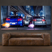 Load image into Gallery viewer, Toyota Supra &amp; Nissan GT-R R34 3-piece framed canvas print – premium motorsport wall art