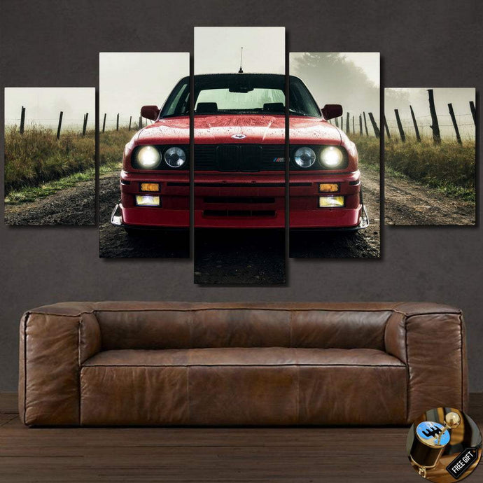 BMW E30 M3 red car multi-panel canvas wall art above brown leather sofa
