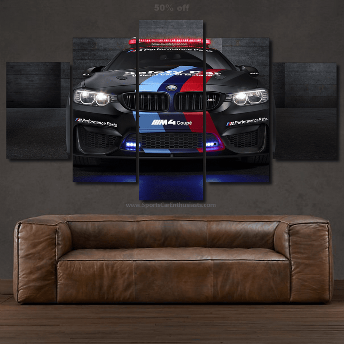 BMW M4 Safety Car canvas wall art with multi-panel framed design above a brown leather sofa
