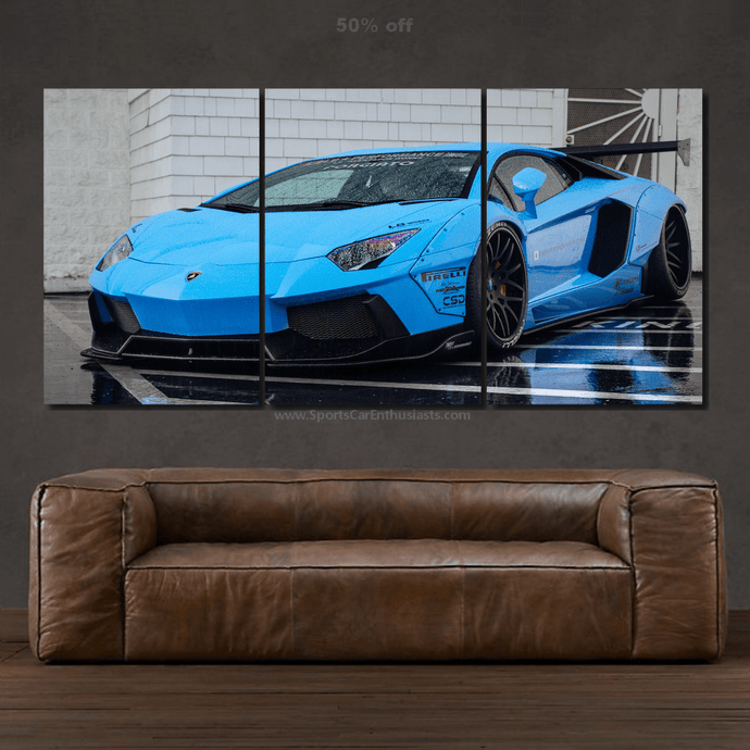 Blue Lamborghini Aventador sports car canvas wall art in three panels above brown leather sofa