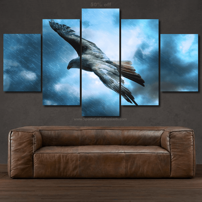 5-piece canvas wall art set featuring a flying bird in a stormy sky above a brown leather sofa