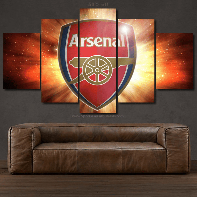 Arsenal FC Canvas multi-panel wall art with vibrant red and gold burst background above brown leather sofa