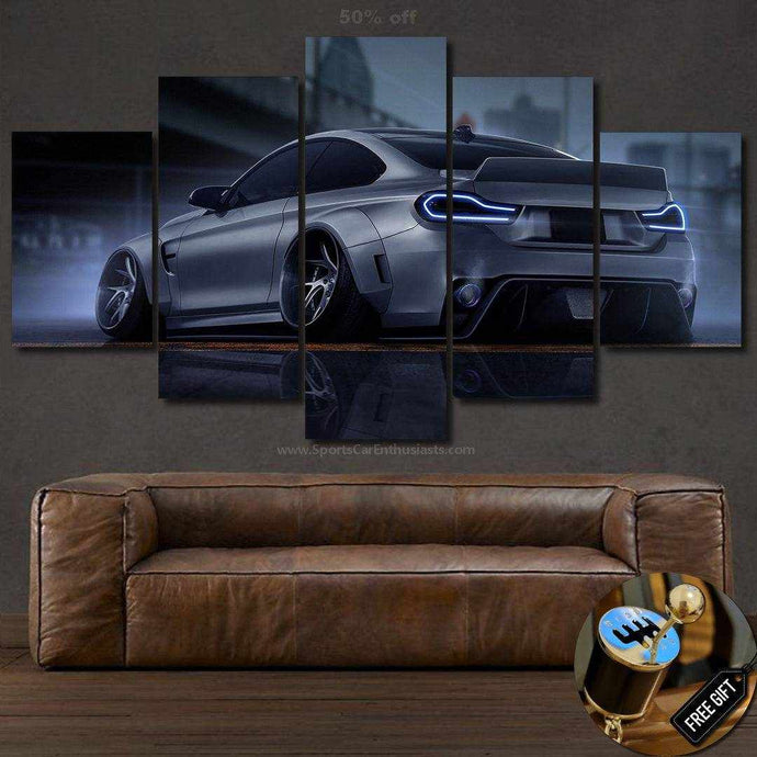 BMW M4 Canvas multi-panel wall art featuring rear view of silver sports car with illuminated taillights above brown leather sofa